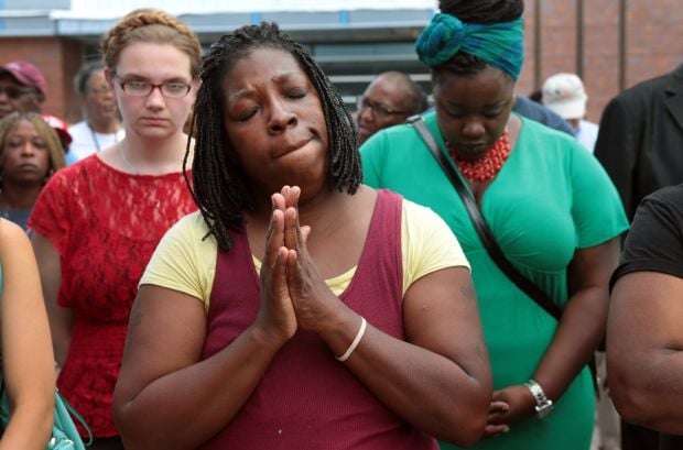 Scores protest police shooting of Michael Brown