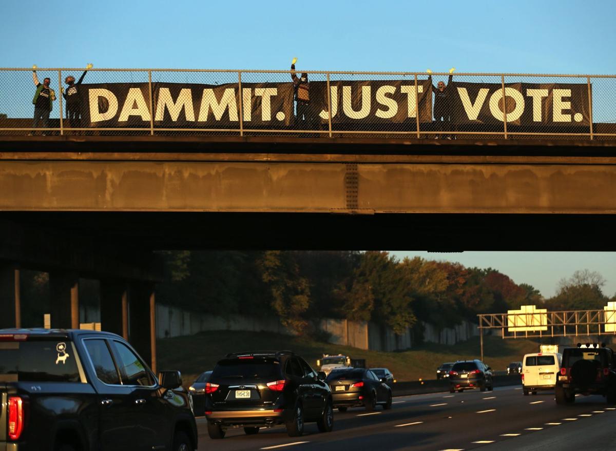 "Dammit. Just Vote." banner hung on Sappington Road overpass at I-270