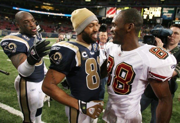 St. Louis Rams wide receiver Torry Holt, right, congratulates rookie wide  receiver Kelvin Kight after Kight made a great reception during the Rams'  minicamp Saturday, May 22, 2004, in Earth City, Mo. (