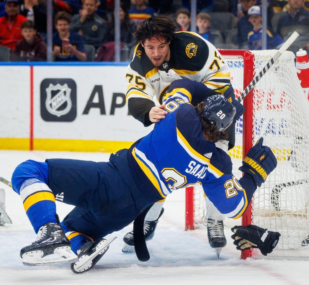 Arizona Coyotes defenseman Josh Brown (3) sends St. Louis Blues right wing  Alexey Toropchenko (13) to the ice as Blues defenseman Marco Scandella (6)  moves in to get the puck during the