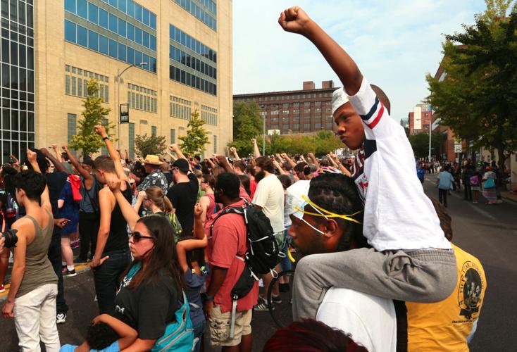 Protests continue downtown, based at police station