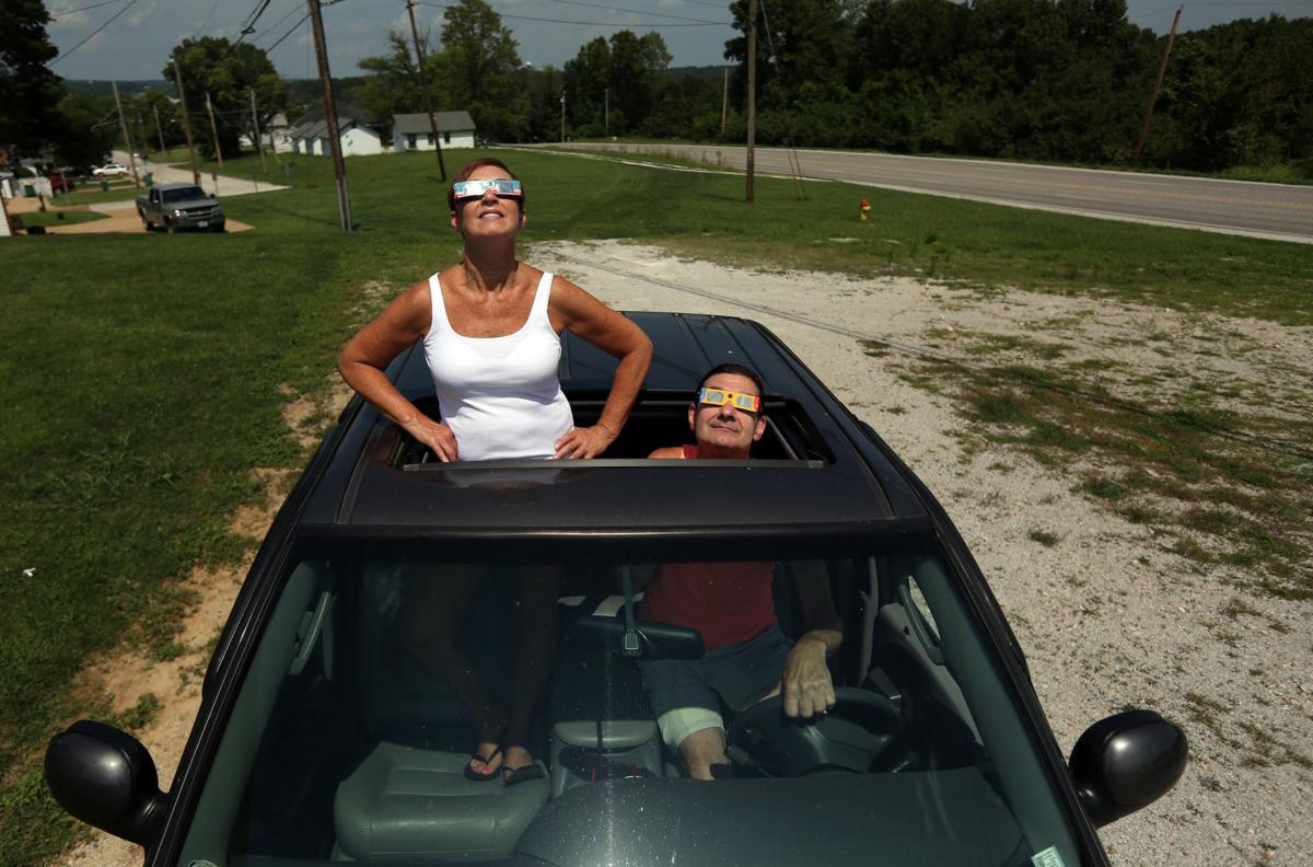 Post-Dispatch photographer walks the path of totality at a Missouri nudist  camp