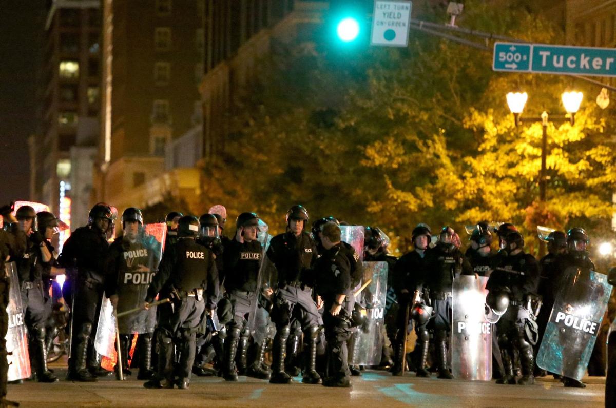St. Louis police officers after kettling at Washington Avenue and Tucker Boulevard in St. Louis