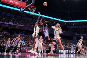 Golden State Valkyries guard Tiffany Hayes (15) goes up for a basket against Indiana Fever center Aliyah Boston (7) on