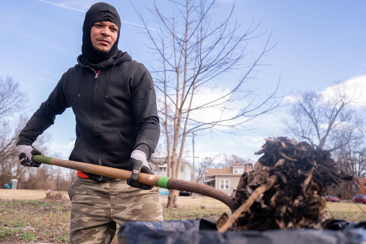Thrashing trash In East St. Louis, volunteers work to clean up their