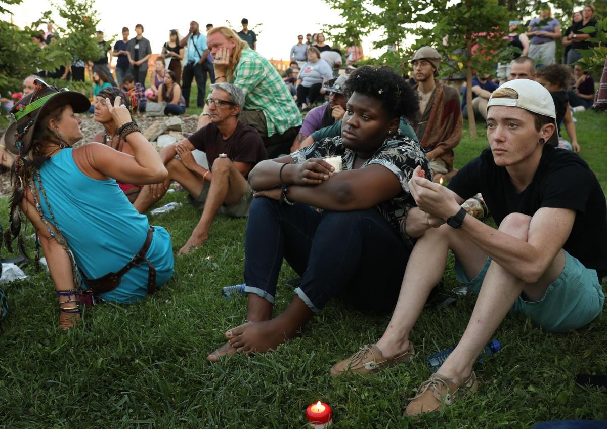 Protesters hold candlelight vigil