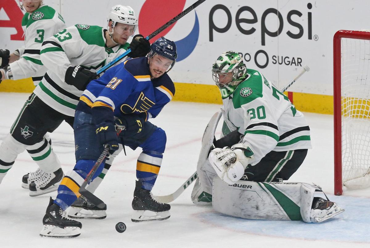 St. Louis Blues' Alex Pietrangelo (27) and Alexander Steen (20) celebrate  with goaltender Jordan Binnington after their 3-2 win against the Dallas  Stars during Game 1 of an NHL second-round hockey playoff