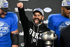 Dec 6, 2025; Charlotte, NC, USA; Duke Blue Devils head coach Manny Diaz celebrates defeating the Virginia Cavaliers at the 2025 ACC Championship game at Bank of America Stadium. Mandatory Credit: Bob Donnan-Imagn Images