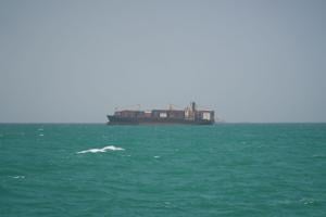 FILE PHOTO: A cargo ship sails in Saudi waters near the Dammam Port in Dammam
