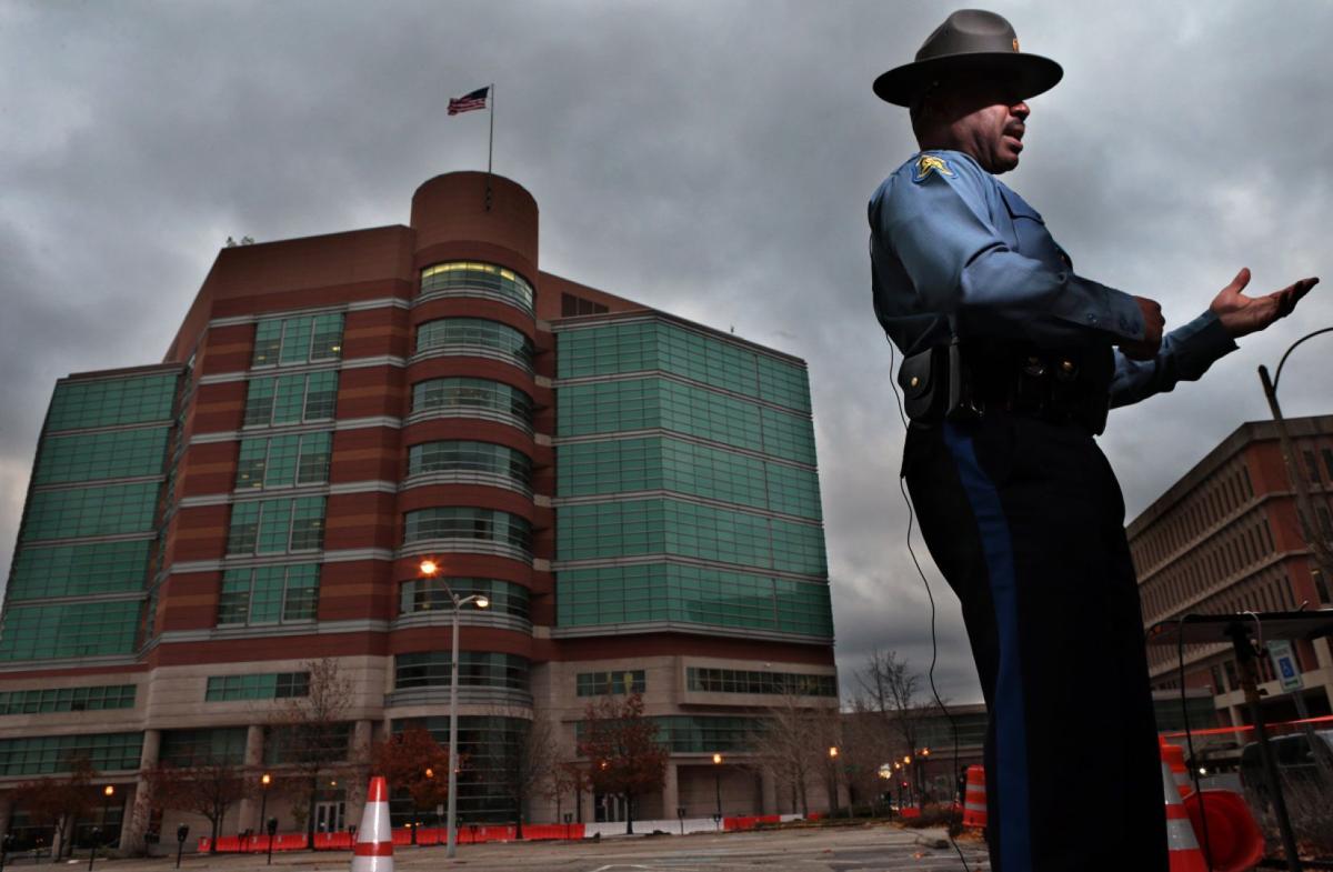 Capt. Ronald S. Johnson speaks with television networks in Clayton