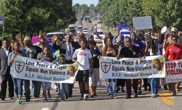 Ministers try peaceful protest through Ferguson