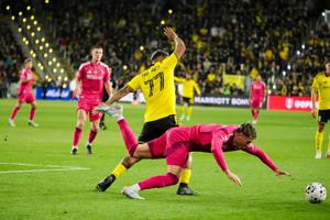 Columbus Crew forward Josef Martinez (77) collides with St. Louis CITY SC defender Lukas MacNaughton (5) during the U.S. Open