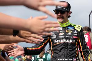 Jul 5, 2026; Joliet, Illinois, USA; NASCAR Cup Series driver Ryan Blaney (12) shakes hands with fans before the eero 400 at Chicagoland Speedway. Mandatory Credit: Mike Dinovo-Imagn Images