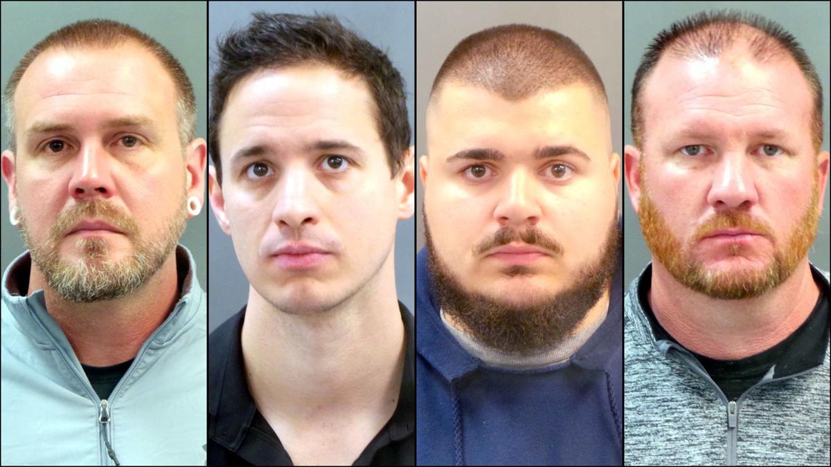 Four officers charged with stealing overtime pay
