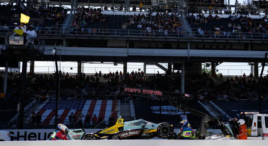 Ed Carpenter Racing driver Alexander Rossi (20) is removed from the front straight after it died on Saturday, May 9, 2026, during the Sonsio Grand Prix at Indianapolis Motor Speedway.