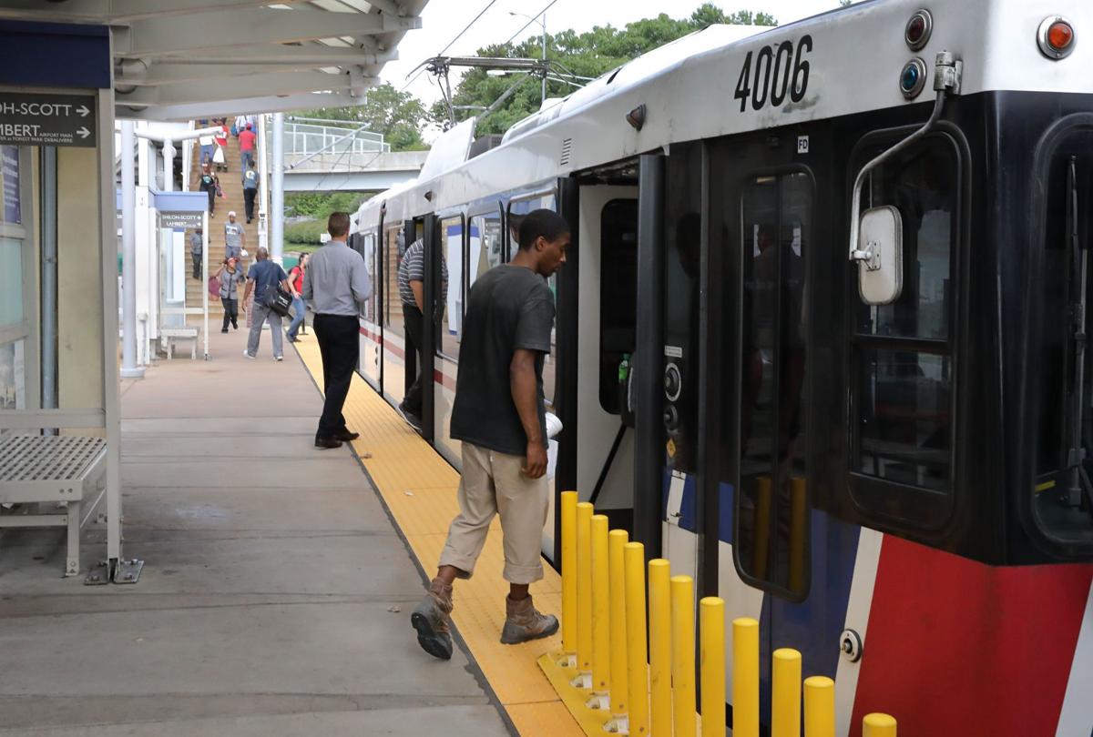 People board MetroLink train at Clayton station, 7/21/17