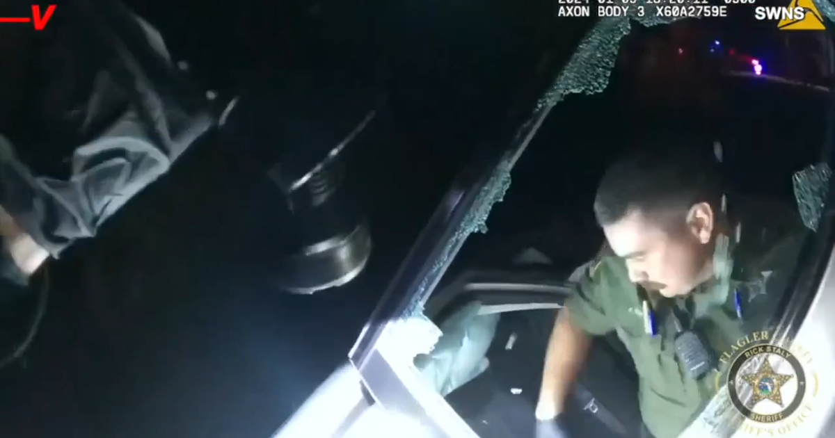 Bodycam video shows Florida deputies rescuing woman and baby from ...