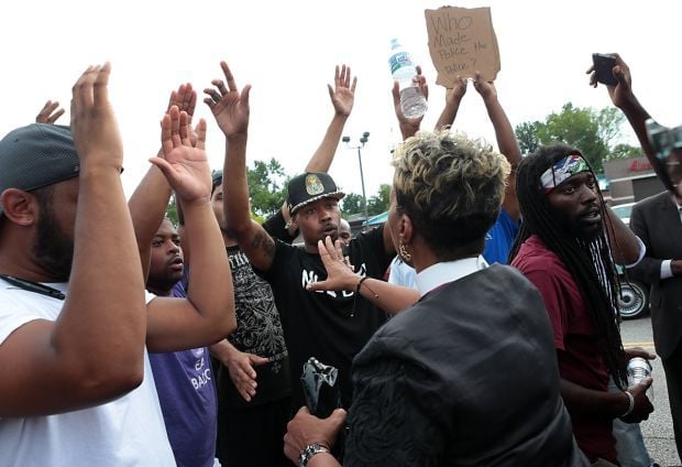 Scores protest police shooting of Michael Brown