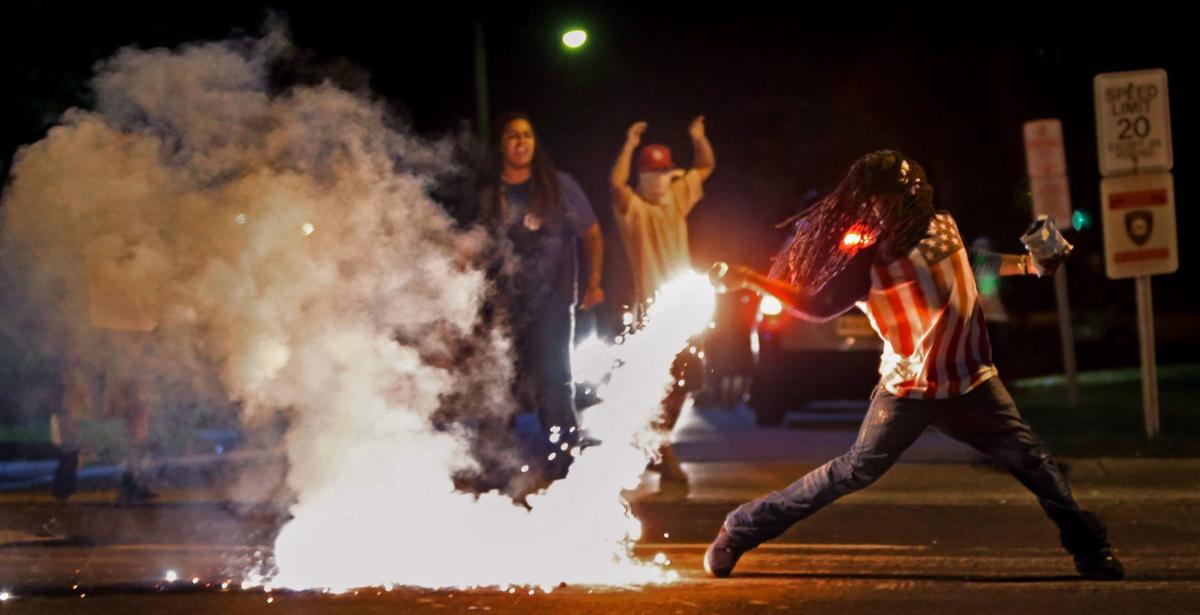 Quieter night in Ferguson ends again with tear gas