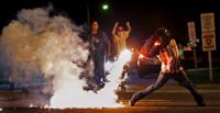 Quieter night in Ferguson ends again with tear gas