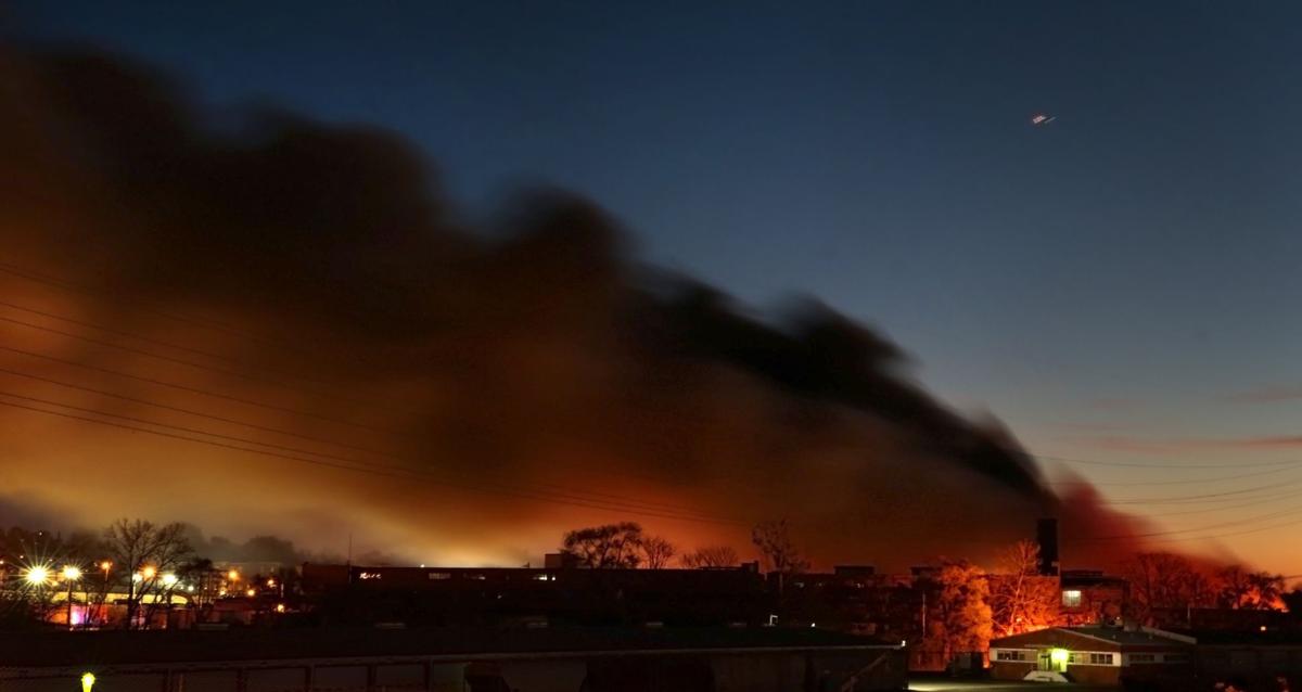 Five-alarm warehouse fire burns through the day