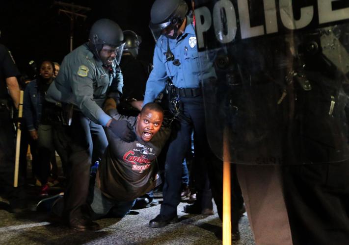More than 150 demonstrators protest in front of Ferguson Police Station