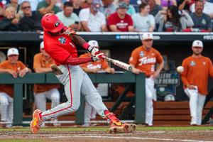 Jun 16, 2026; Omaha, NE, USA; Georgia Bulldogs third baseman Tre Phelps (1) drives in a run on a double against the Texas Longhorns during the fifth inning at Charles Schwab Field. Mandatory Credit: Dylan Widger-Imagn Images