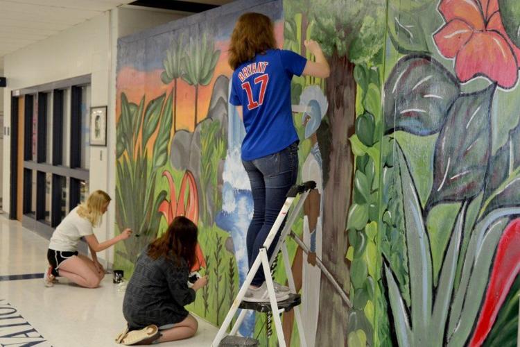 Students paint murals where car crashed through Francis Howell Central