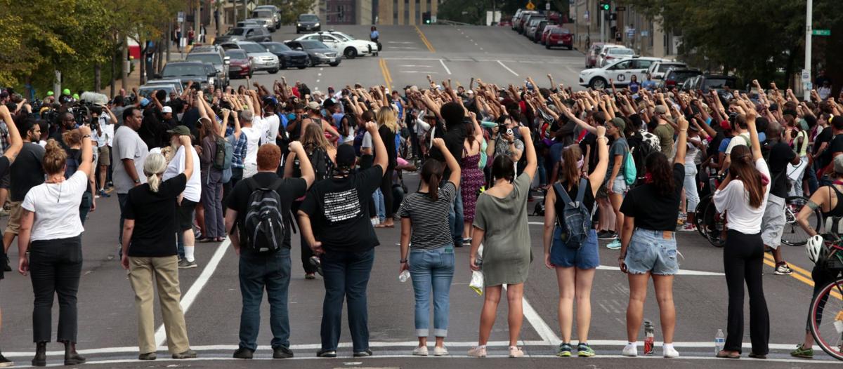 Protests continue downtown, based at police station