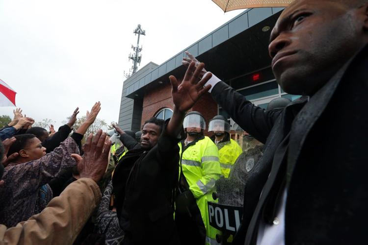 Clergy demonstrate at Ferguson Police Department