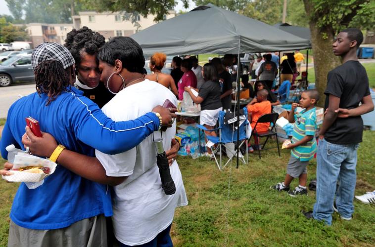 Rev. Tatman talks with residents
