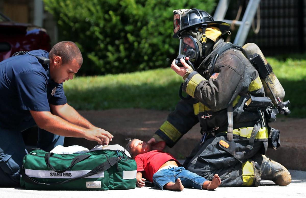 Photos Firefighters rescue four children from burning St. Louis