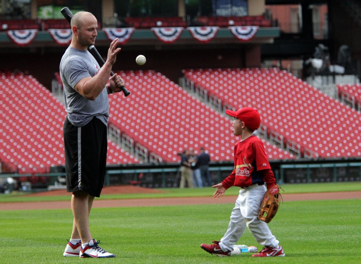 Matt Holliday with his son at Dodger Stadium during the NLCS