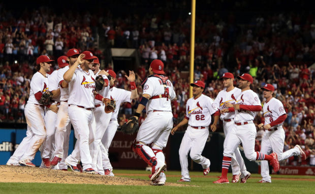 CARDS WIN THE RACE IN NL CENTRAL