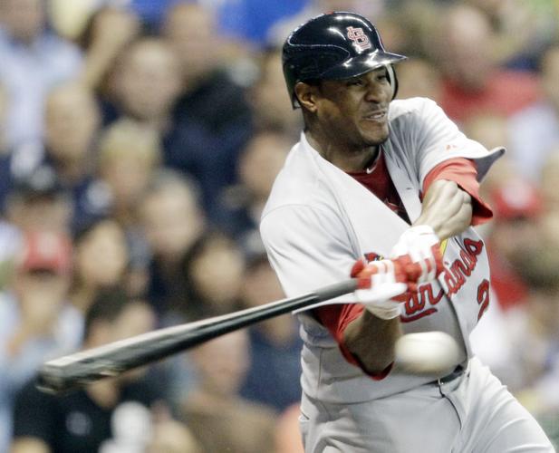 Texas Rangers' Jerry Hairston Jr., reacts to sliding in hard and