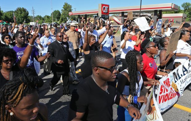 Ministers try peaceful protest through Ferguson