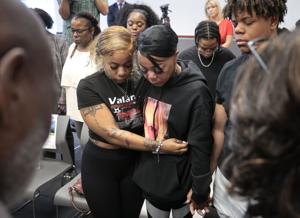 Ferguson police arrest three in bystander mother’s shooting death