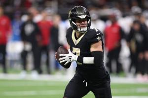 Nov 23, 2025; New Orleans, Louisiana, USA; New Orleans Saints quarterback Taysom Hill (7) rolls out against the Atlanta Falcons during the second half at Caesars Superdome. Mandatory Credit: Stephen Lew-Imagn Images