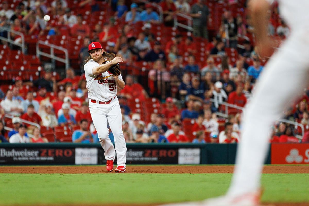 St. Louis Cardinals' Alec Burleson, left, congratulates Andrew Knizner (7),  who scores after hitting a two-run home run against the Chicago Cubs during  the eighth inning of a baseball game Thursday, July