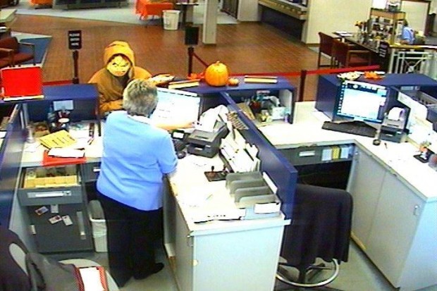 Bank surveillance photo of robber in Chucky mask