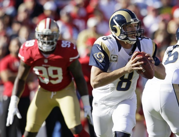 St. Louis Rams quarterback Sam Bradford (8) watches a replay after