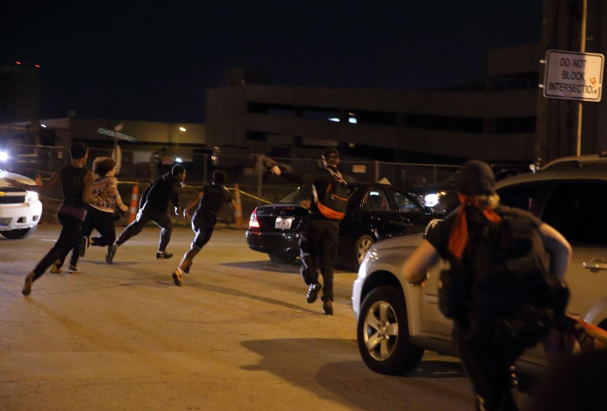 Car drives through protesters in St. Louis