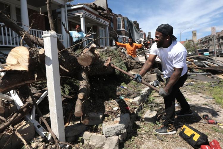 Clean up begins after a tornado damages ѿý area