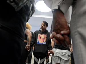 Ferguson police arrest three in bystander mother’s shooting death