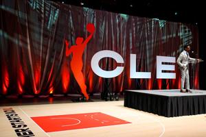 Cleveland Mayor Justin Bibb addresses attendees of a Cleveland WNBA event celebrating the return of professional women’s