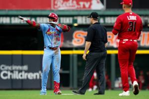 Cardinals' powerful comebacks not enough as Reds slide home in 11th to split doubleheader