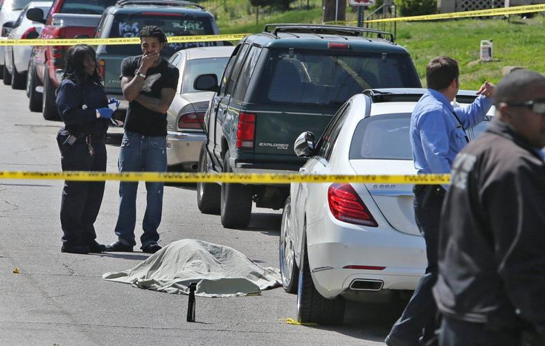 St. Louis police ID man fatally shot while polishing wheels on his car