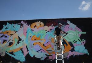 Paint St. Louis puts new art on an old downtown St. Louis wall
