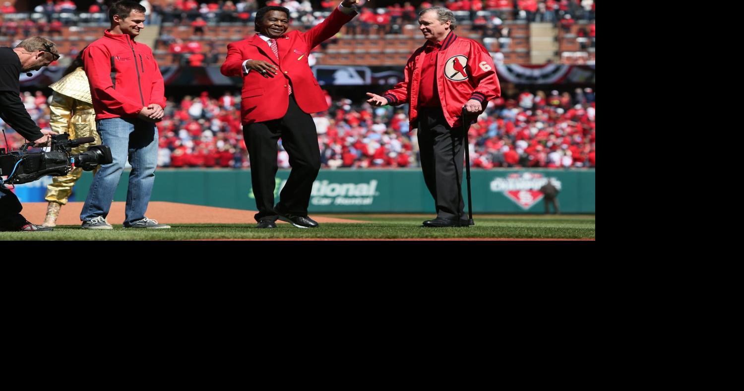 Baseball Hall of Famer and former St. Louis Cardinals great Lou Brock and  his wife Jackie talk to fans on the field before a game between the  Cardinals and the Boston Red