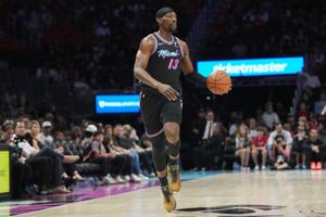 Miami Heat center Bam Adebayo brings the ball up the court against the Washington Wizards during the first half at Kaseya Center.